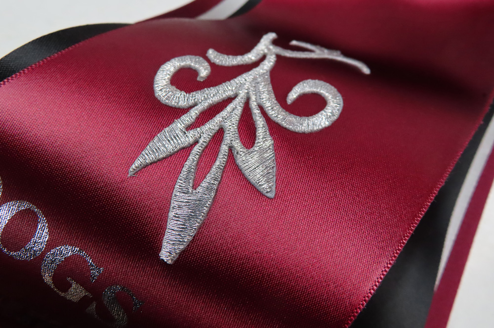 Embroidery on a bespoke rosette.