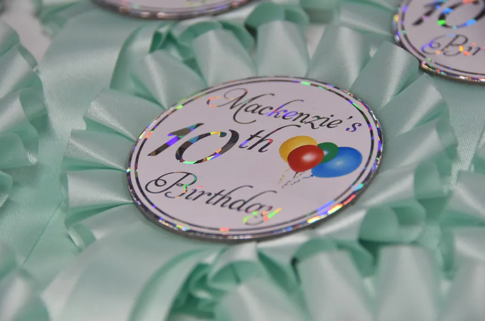 One tier economy rosettes with custom printed button.