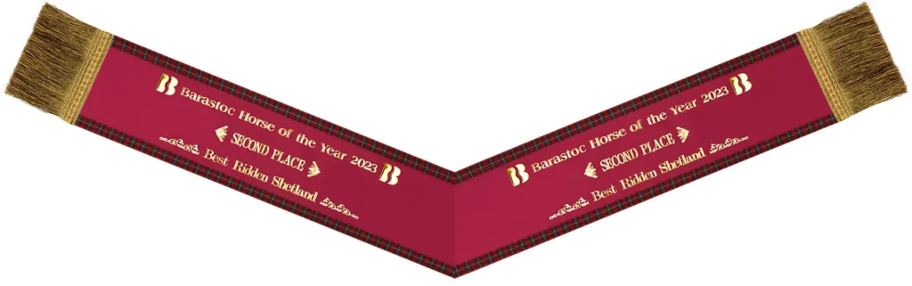 Equestrian v-neck sash with tartan edging.